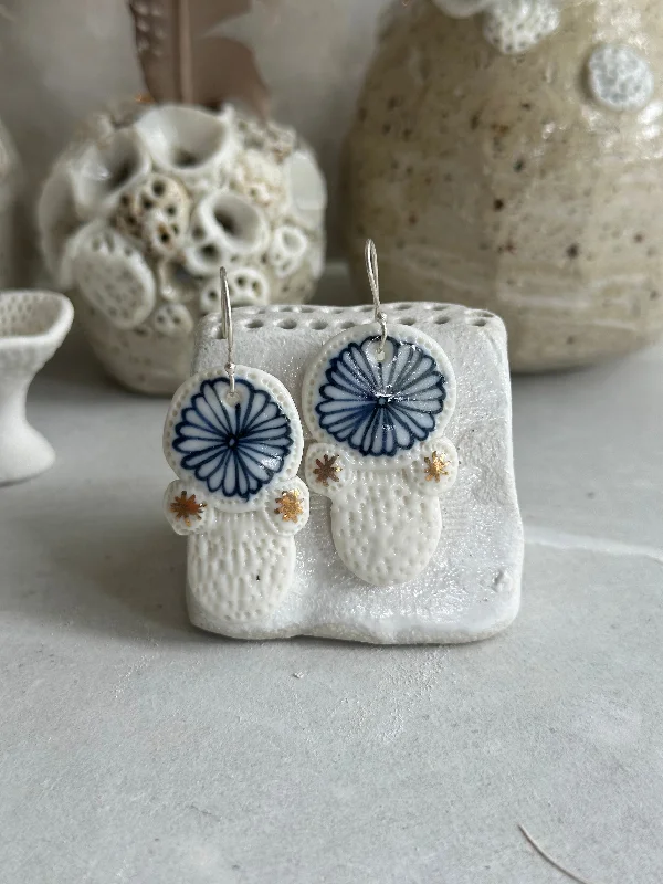 Blue and white hand painted porcelain earrings with gold lustre detail.